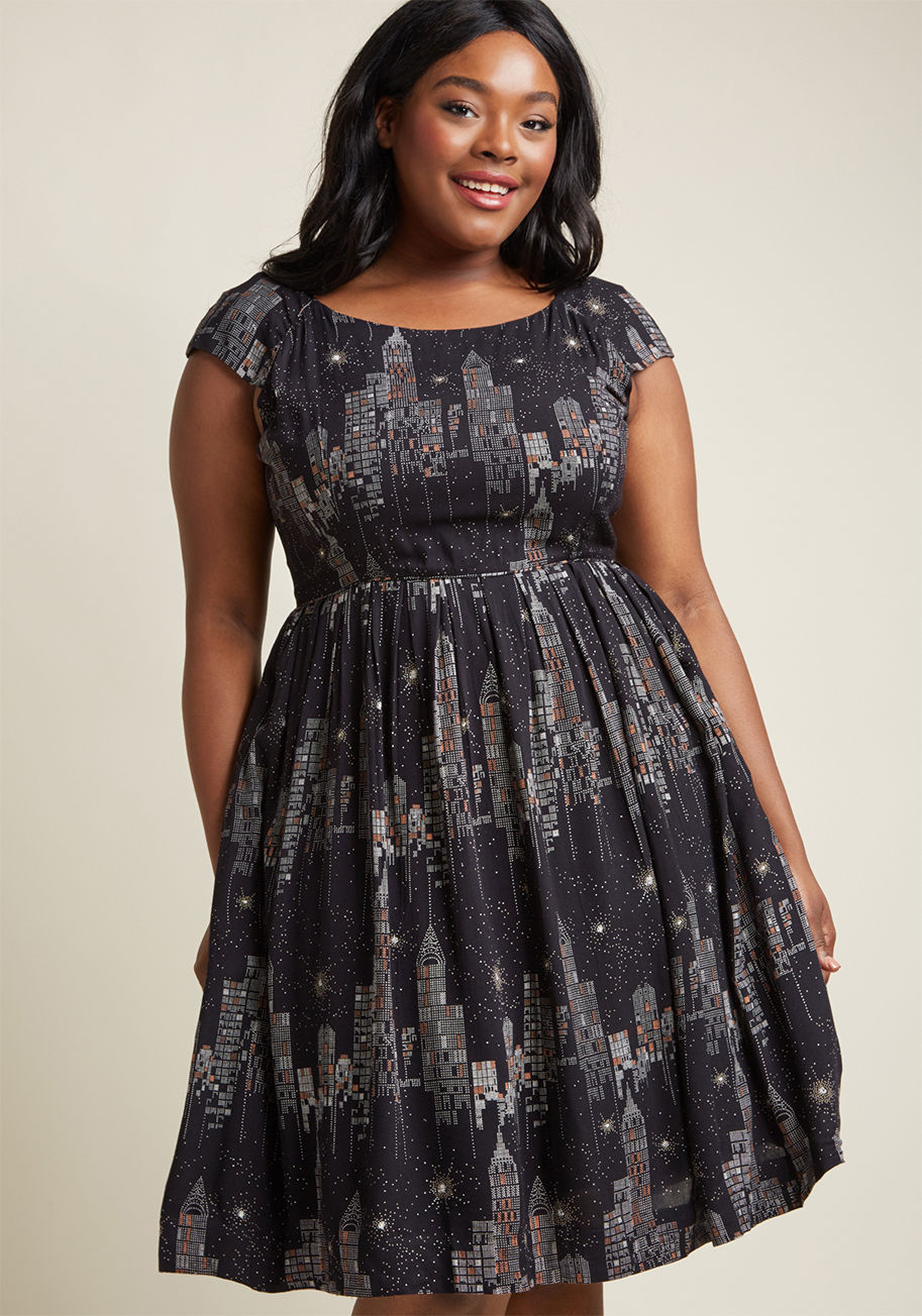 CLD-0191VR - There's a lot to love about this midi dress by hard-to-find British brand Emily and Fin. In a rich black hue, this cotton A-line stars a ModCloth-exclusive print of the New York City skyline at night, a bateau neckline, and a pleated skirt, making this vi