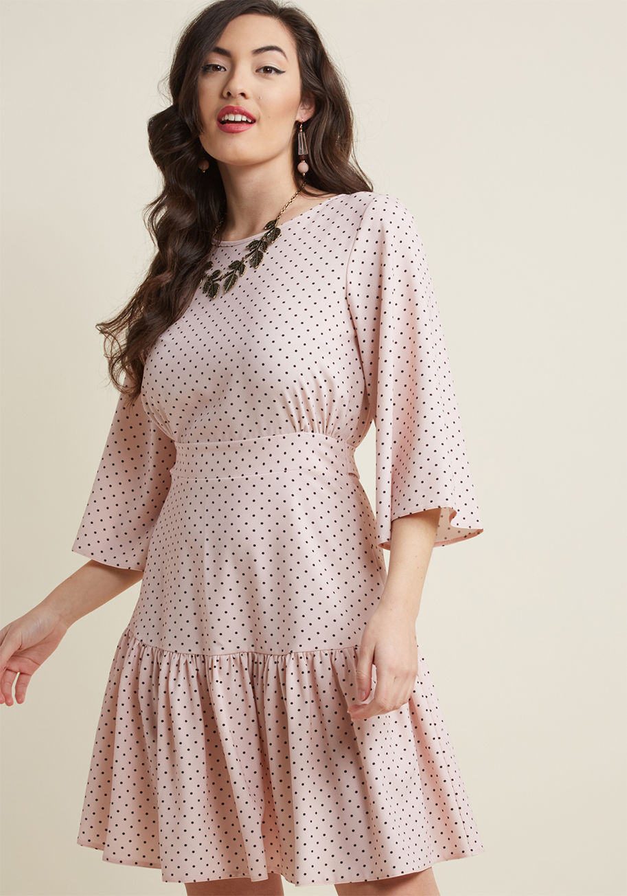 D3643 - You're chuffed to flaunt this pastel pink dress from Closet London, and you don't care who knows it! The 3/4-length bell sleeves, gathered-and-tied waist, and ruffled hemline of this dress flaunt fun personality, while its back keyhole, golden exposed zip