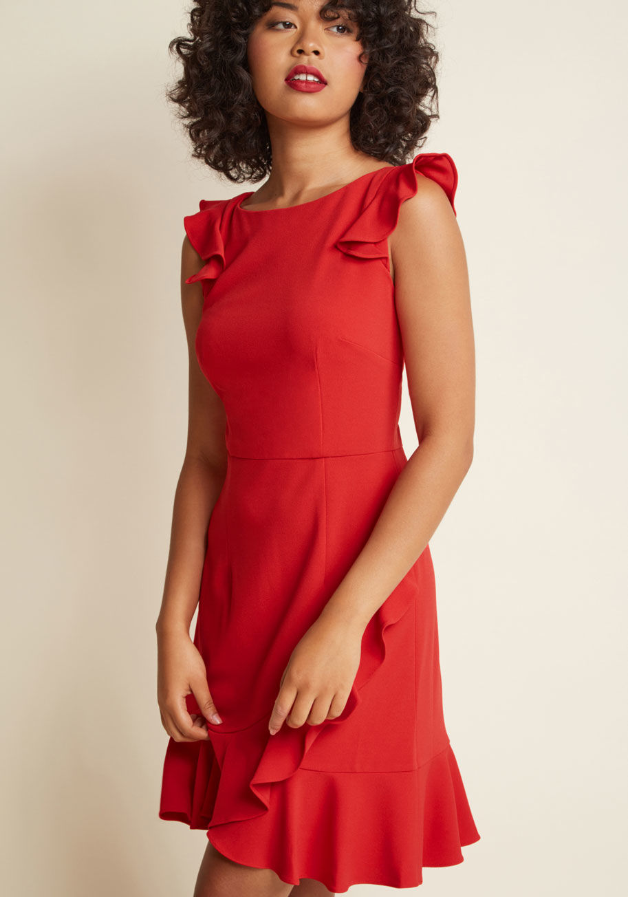 D5321M - The impression you'll leave from sporting this spectacular red dress will echo throughout style history! Donna Morgan serves up this gorgeous frock with ruffles at the cap sleeves and hem, giving movement and dimension to its thoughtful tailoring and deep