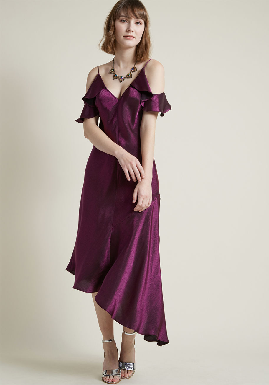 D5642M - This silky slip dress by Donna Morgan has what it takes to achieve the highest levels of haute. Designed with slim spaghetti straps, elegant off-shoulder ruffles, and a deep V-neckline opposite a matching V-back, this royal purple dress is endlessly chic.