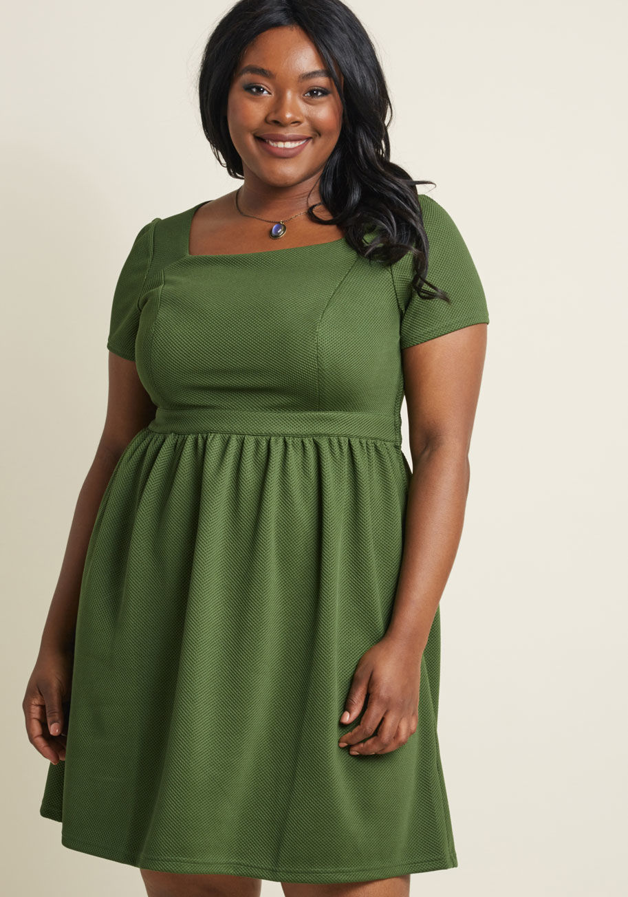 D61218 - It's all we can do to avoid flaunting this dress every single day of the week! It's just that its simple A-line silhouette and bright green hue can be styled so very many ways! Straying from the norm with a square neckline and textured knit, this ModCloth