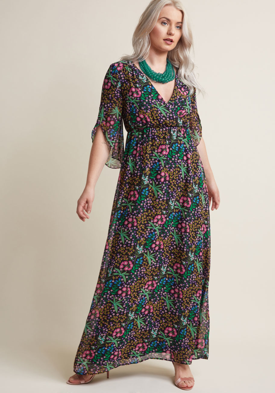 D61338 - Perhaps it's the way this chiffon maxi dress drapes over your form and imbues it with elegance. Maybe it's how the tulip-style half sleeves of this ModCloth-exclusive frock continue their wrap-like motif to the surplice neckline. It could be the gorgeous 