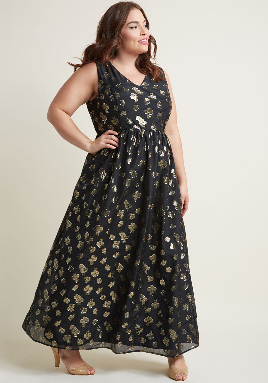 D61712 - Any illuminated space will serve as your spotlight, as long as you're flaunting this black maxi dress! A sensational style exclusive to ModCloth, this V-neck gown glistens with a cascading motif of metallic gold flowers, creating a glowing garden of fashi