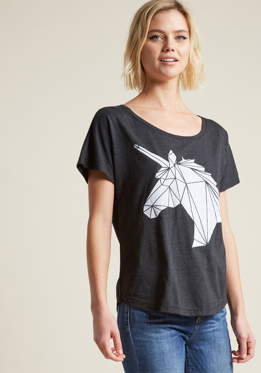 D6718 - We all know the tale of the crystal unicorn - or perhaps we're combining our fairytales? Either way, the scoop neckline, dolman sleeves, and geometric unicorn graphic of this black tee have all the necessary elements for you to create your own legendary s