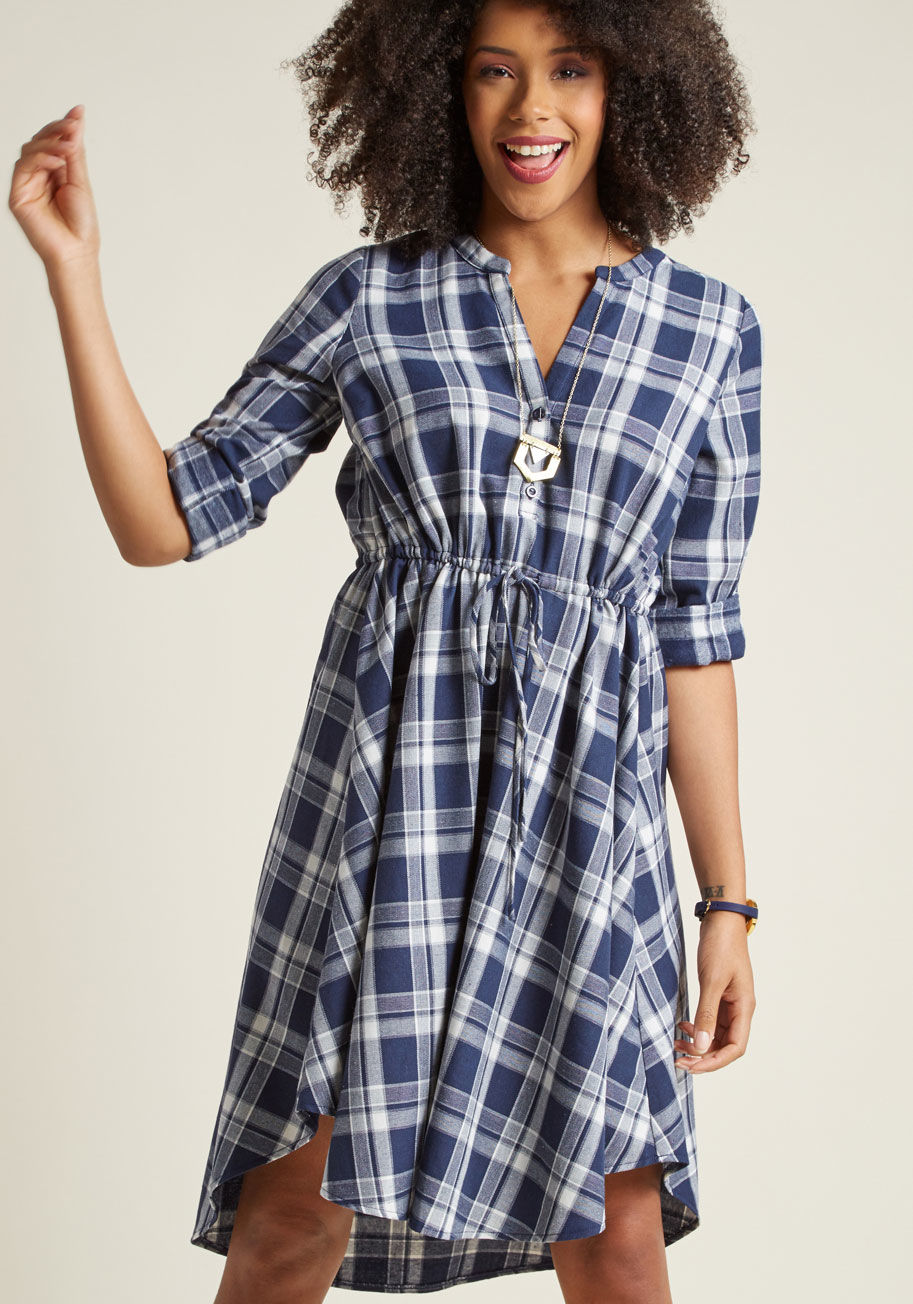 D929 - Creating a cozy-as-can-be look is simple with this blue plaid shirt dress as the centerpiece! Crafted from toasty flannel fabric, this ModCloth-exclusive frock infuses a rustic style with fashionable elements, such as tabbed sleeves, a drawstring waistlin