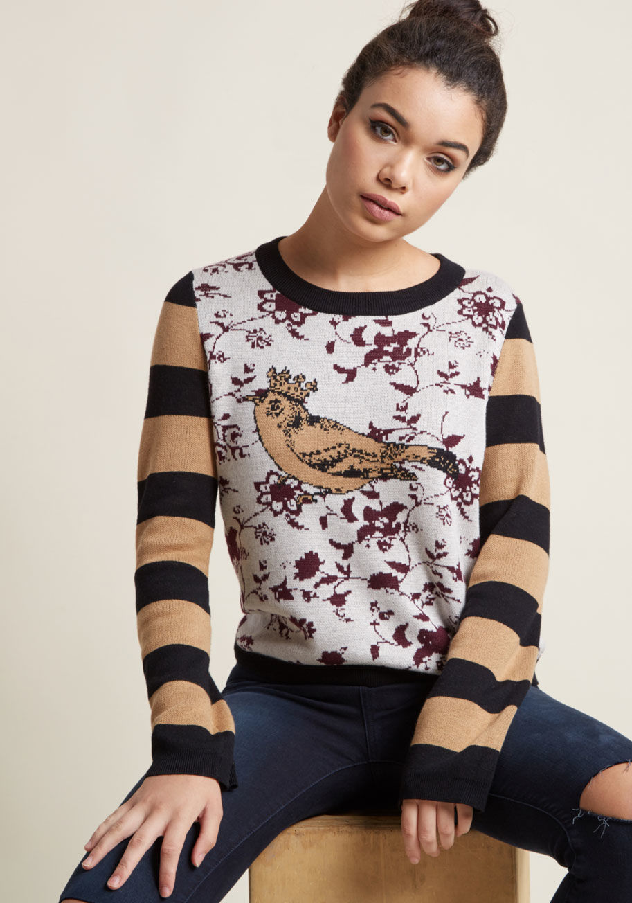 DF12 - This patterned sweater makes it simple to motif mix to your heart's content - and others are sure to take notice! Black and tan stripes on each sleeve frame the maroon flowers and regal intarsia bird of this grey pullover - a piece that makes your quirky 