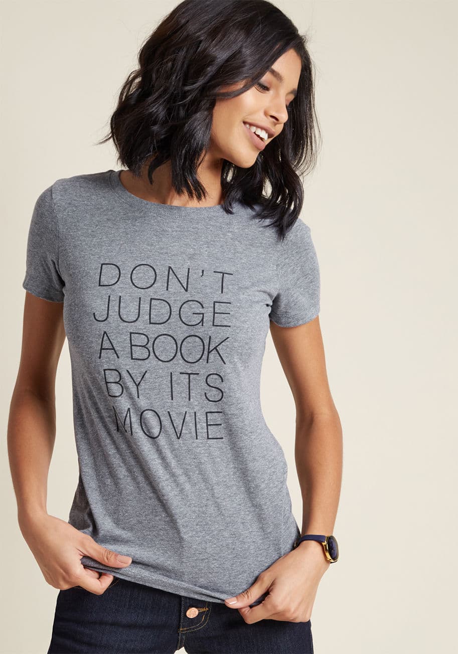 Don't Judge a Book - This grey graphic tee has a mission of warning others about poor cinematic sequencing - will you help its cause by flaunting it with frequency? With its crew neck, casual heathering, and ModCloth-exclusive screen print, this lit-lover's T-shirt calls upon