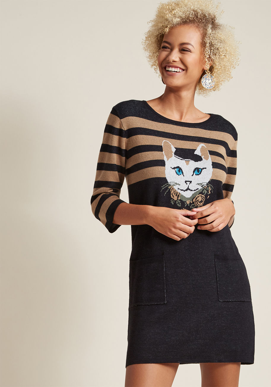 DR10 - If you're unsure of how to style up this black sweater dress, turn to its chic intarsia kitty for inspiration! Clad