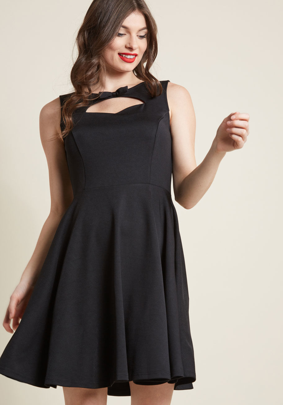 DR5410 - One great perk of being an entrepreneur is the freedom to flaunt a professional dress with flair - like this A-line LBD! Tailored with princess seams and hidden pockets, this knit dress tips its hat to a classic. It's the neckline cutout - topped with a p