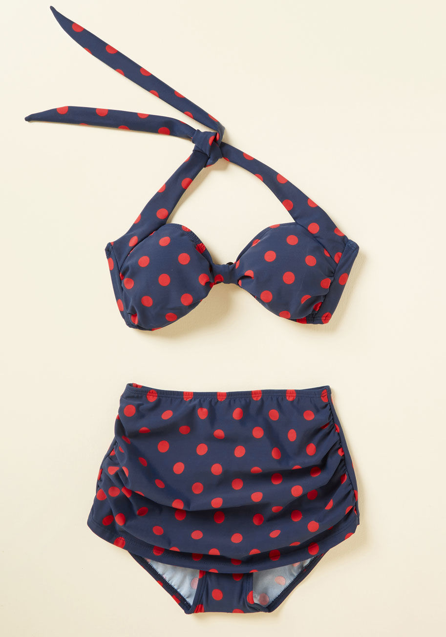 E09006p - Inspired by our favorite beach party film, this navy swimsuit bottom is flattering on many body types. Designed by the iconic Esther Williams and featuring a bold, red-dotted print, low-cut legs, and touches of ruching, this high-waisted swimwear will sho