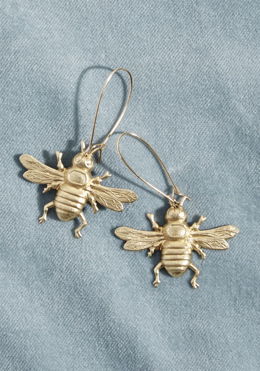 EC030 - May we suggest these bee earrings as your next nature-inspired style? With comfortable loops and stamped brass charms, this nickel-free pair infuses quirk and cuteness into your look.