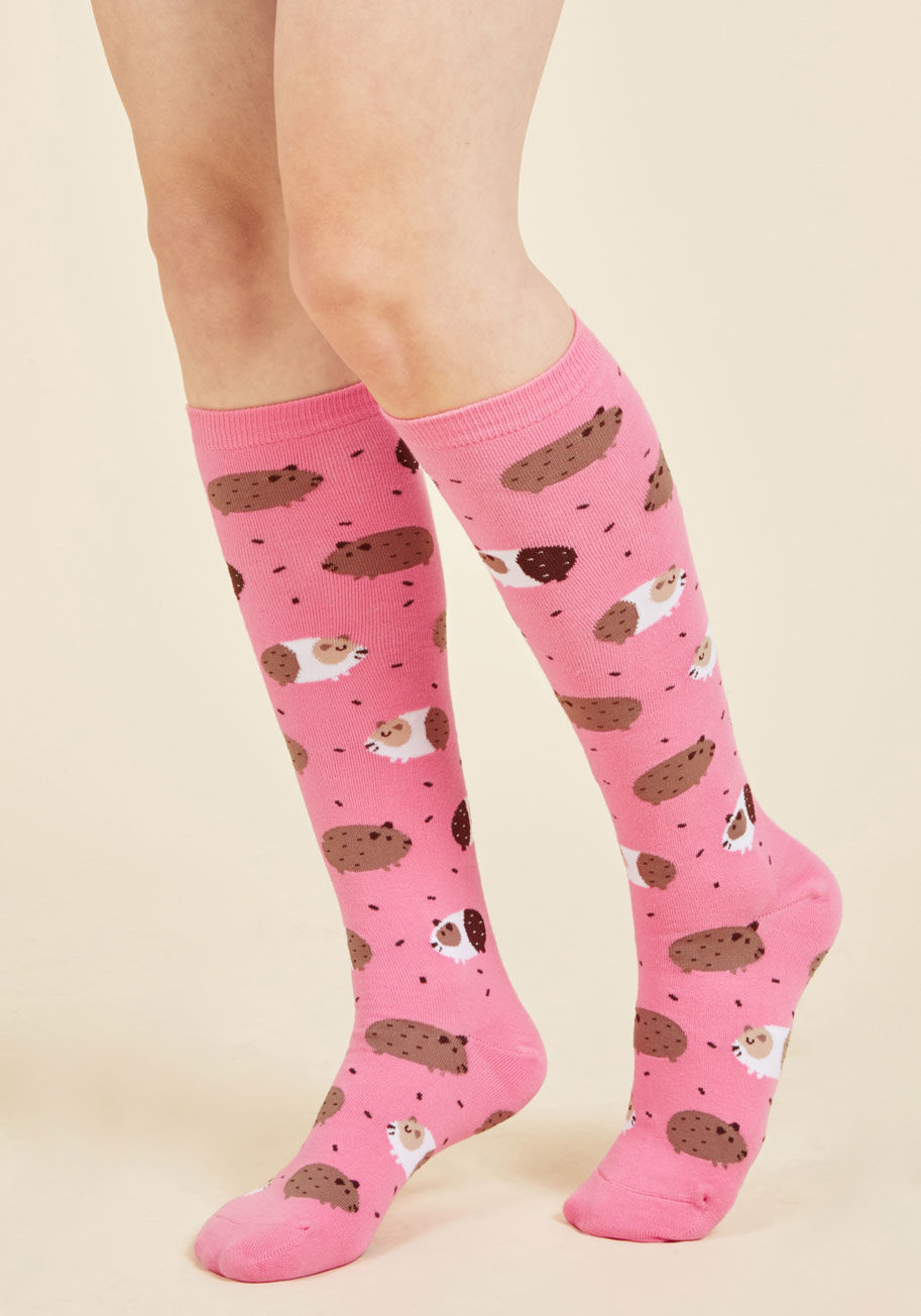 F0344 - You'll reach a new level of quirky style by donning these pink knee socks! Decorated with gleeful guineas