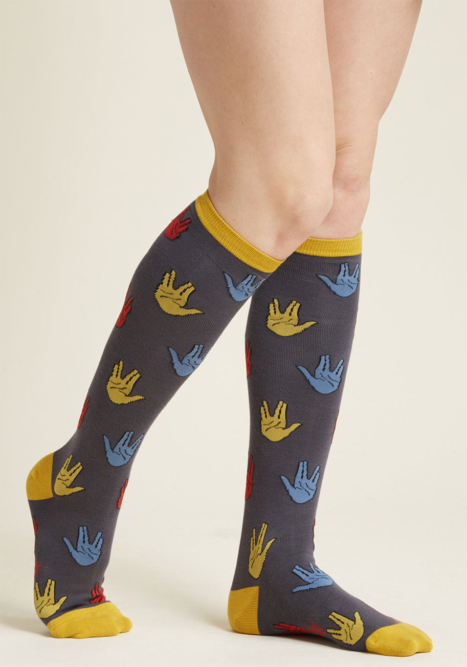 f0388 - We salute any stylista who sports these Star Trek knee socks! Patterned with primary colored palms offering sci fi salutations and goldenrod trim, these grey socks are totally Vulcan vogue.