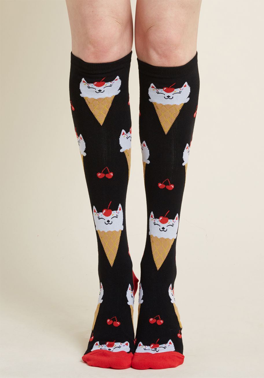 F0411 - These black socks are so unexpectedly adorable, they may just leave you speechless! Once you regain your words, feel free to call the ice cream kitty print of these sweet knee highs exactly as you see it - totally 'claw-some'!