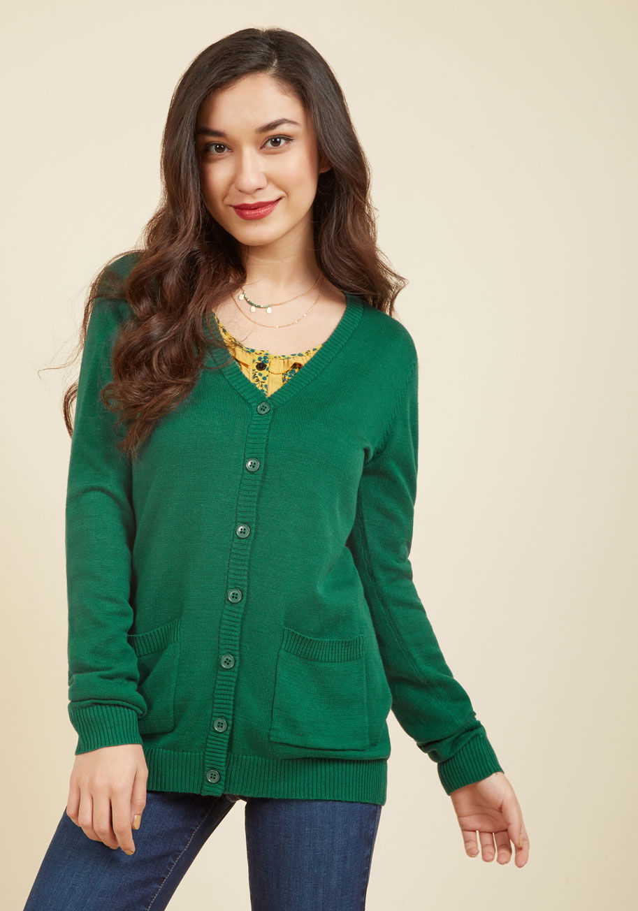 F8018 - Fill your schedule with chic, day-to-night coziness by slipping into this ModCloth namesake label sweater. Featuring handy patch pockets, ribbed trim, and a relaxed, V-neck silhouette, this classic evergreen-hued cardi keeps you