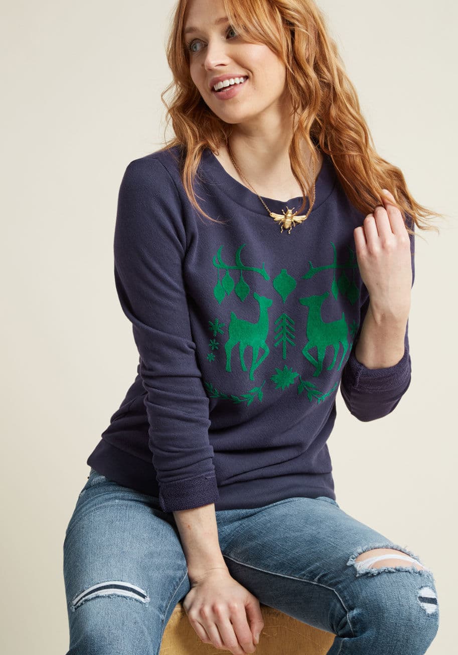 F8022O - Organize your outfit into the most wonderful ensemble of the year, using this navy blue sweatshirt! A cozy ModCloth exclusive, this pullover flaunts green velvet flocking, featuring a deer duo among garland, ornaments, and snowflakes. This garment is just