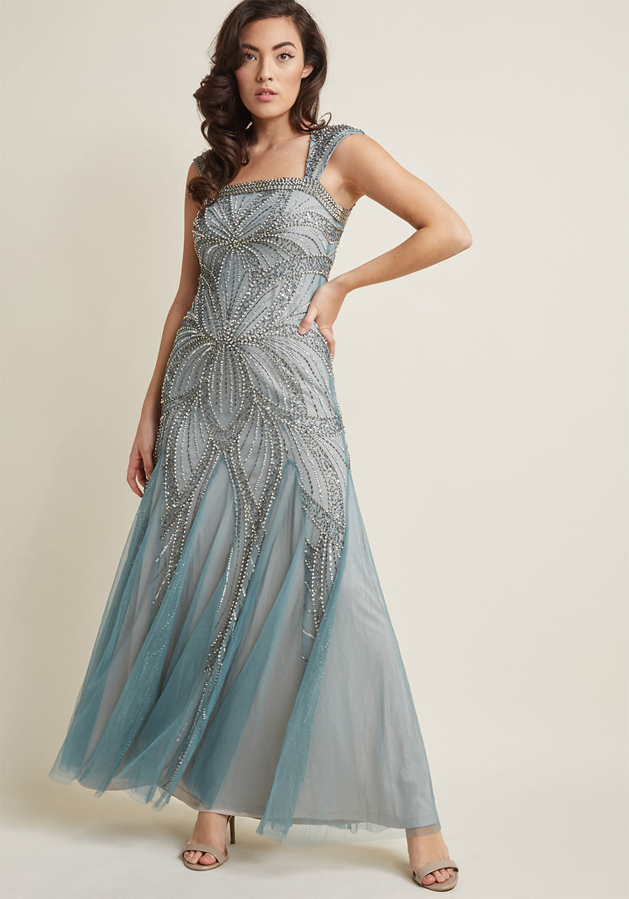 FF009KK - As effortless as it is exquisite, this sky blue ball gown is utterly charming! Exuding vintage-inspired vibes from its flower-bursting beading, this decadently detailed dress boasts an array of silver sequins and pewter beads, a mermaid-style hemline, and