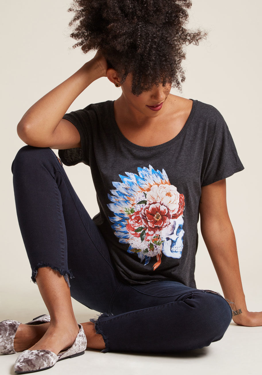 Floral Skull - Feeling comfy, but looking edgy, is the name of the game with this charcoal graphic T-shirt! A ModCloth-exclusive boasting a wide neckline and dolman short sleeves, this top flaunts a painted skull wearing a floral-and-feather headpiece.