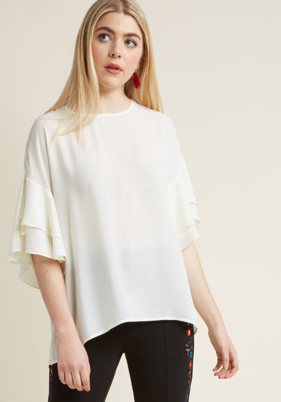 FT88126-1P - This ivory blouse is the epitome of indulgent style. Its sheer chiffon fabric offers an ethereal vibe, while the tiers of ruffles garnishing its short sleeves are an extravagant representation of elegance. With a buttoned keyhole closure and a roomy fit, 