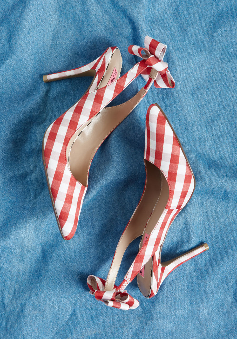 GINJER - What will these Betsey Johnson heels ignite inside of you? We venture to guess that the sleek stilettos, pointed toes, and bow-topped slingbacks of these red gingham stunners shall inspire your foxiest side to come to life. How will you know? Give 'em a g