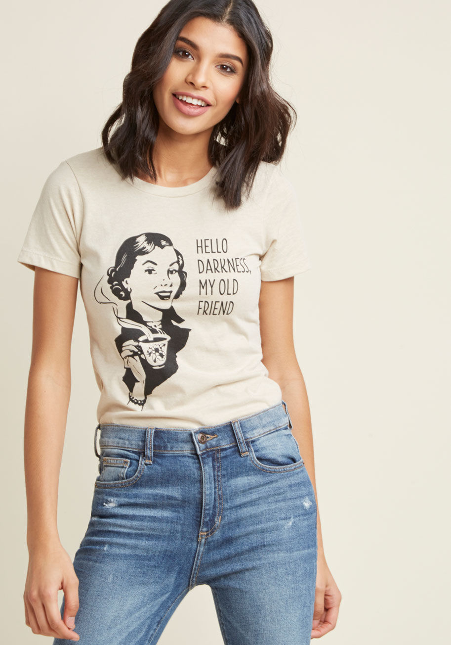 HELLO DARKNESS - When the coffee pot greets you with its soothing aroma, return the warm salutations with this quirky graphic tee! A ModCloth exclusive, this ivory T-shirt is infused with amusing energy, courtesy of its java-lovin' black screen print. A perfect pick for t