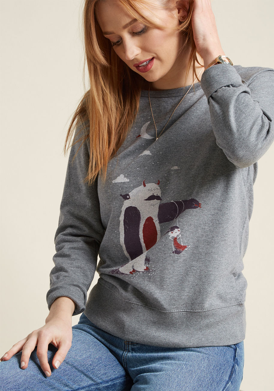 Helping Hand - The raglan long sleeves and super-soft interior of this heather grey sweatshirt have your comfort on lock. And, as for your unbeatably good mood? That's thanks to the friendly Yeti offering an arm to this screen print's sweet, swinging gal! A ModCloth-exc