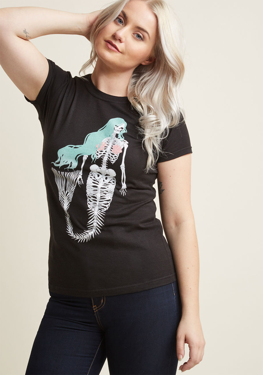 IMA0067 - Word about this black graphic tee is bound to get out, so snag one and await the incoming tide of compliments! Atop the cotton fabric of this crew neck T-shirt lies an eccentric screen print of a skeletal mermaid, making for a design that's a thing of leg