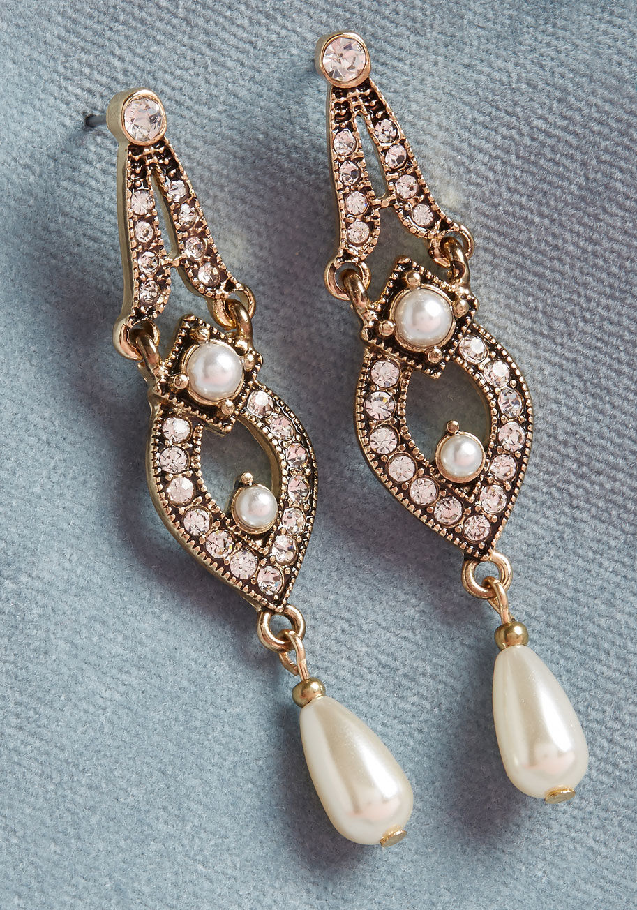 IMG-1860 - Make your elegant ensemble all the more elaborate by adding these fancy gold earrings! A ModCloth-exclusive pair, these rhinestone-encrusted danglies feature a deco-inspired design and faux pearls ready to contribute resplendence to your radiant smile. Ju