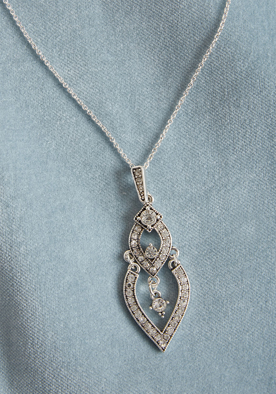 IMG-1863 - This silver necklace features a fine silver chain, at the end of which a rhinestone-encrusted pendant flaunts two tiers of '20s-inspired teardrops. So fancy! A ModCloth-exclusive accessory with old school flair, this fabulous necklace is fit for back-to-b