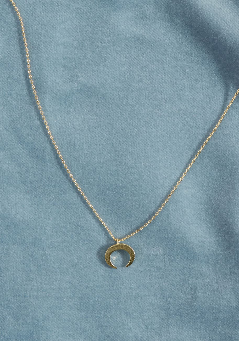 IN4006GD - The past sure was posh, but you're focused on today - the day you debut this golden necklace! Comprised of an ever-so-delicate chain and a petite, brushed gold crescent pendant, this daily accessory is downright dreamy.