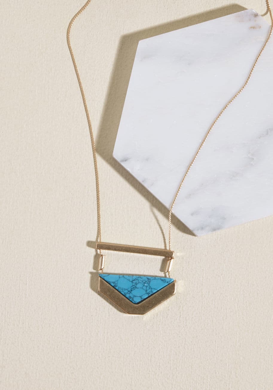 IN4629TQH - No need to explain why you love flaunting this chevron necklace - you let the design speak for itself! The aqua pendant and gold accents of this incredible accessory effortlessly rep your love of modern accessories.