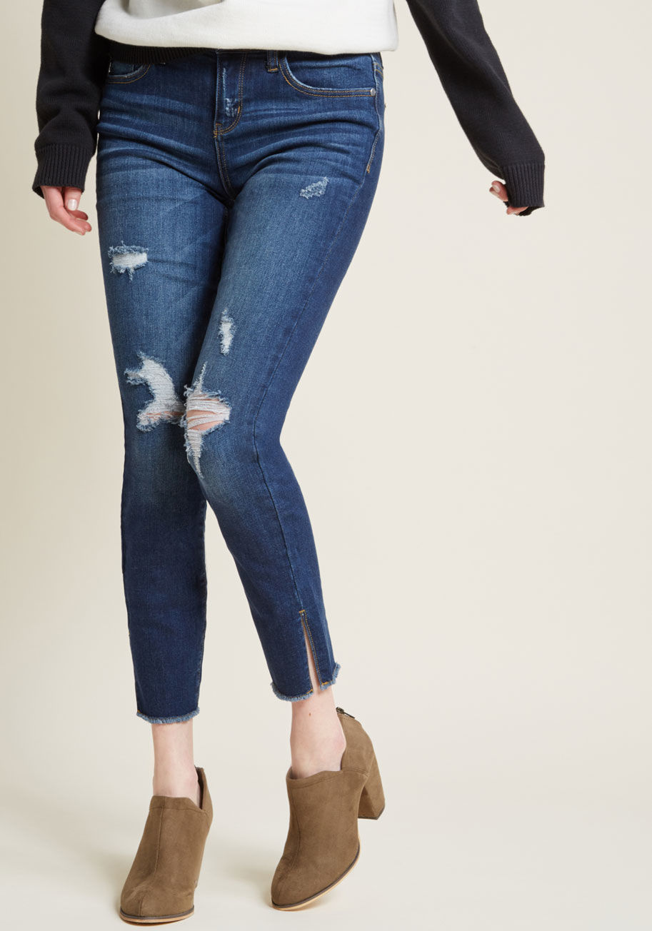 JB8276 - Once a distant admirer of distressed jeans, you're now a full-blown fanatic! That's why these dark blue skinnies are such a big deal to you! Faded, ripped, and featuring vented raw hems, this five-pocket pair is awesomely unforgettable.