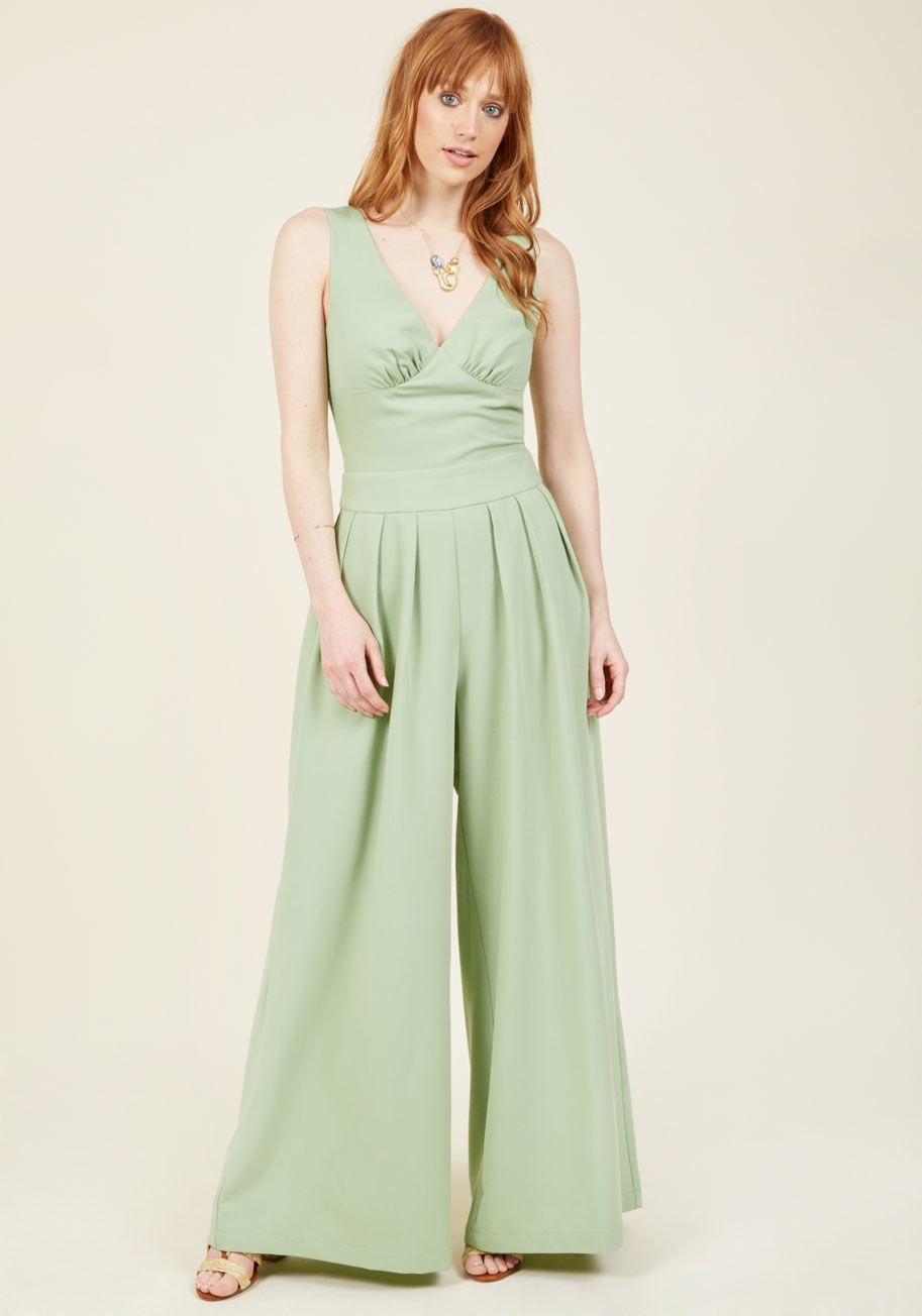 JSA5617 - The vintage-inspired detailing of this stunning, mint jumpsuit will leave your amour totally breathless! Subtle gathering at the bust and pleats below the waist give incredible depth to this retro ensemble, as its wondrous, wide legs round out a look of a