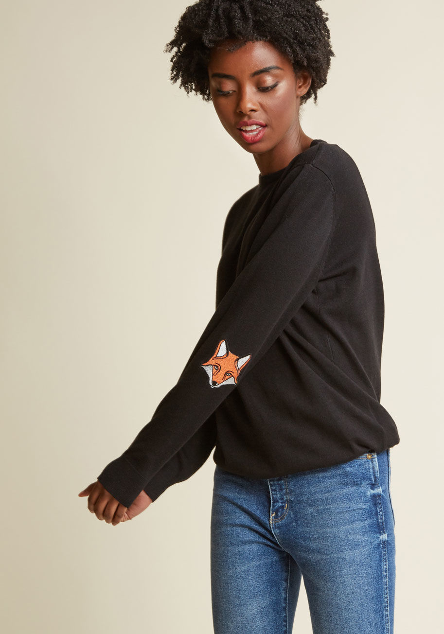 K0027 - Deriving from your big debut of this black sweater by Sugarhill Boutique, you'll feel a passionate attachment to its long sleeves and simple silhouette. Everytime you turn, the embroidered orange fox appliques posted up at the elbows take onlookers by sur