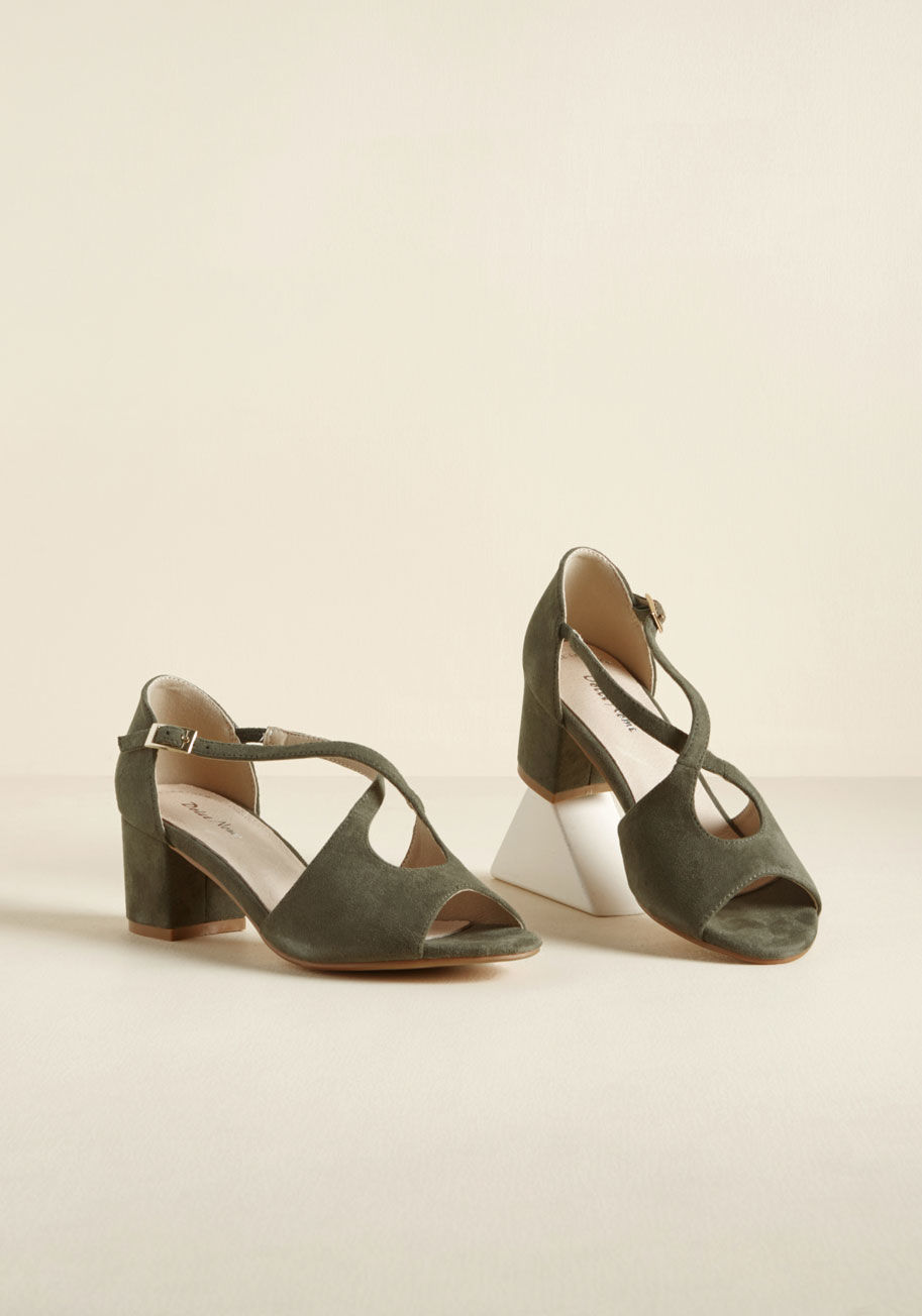 Maggie - Make a pact with these olive green block heels to rock 'em on the reg! Versatile with an air of intrigue, these peep toes tout crisscrossing uppers crafted from soft faux suede, lovely leather linings, and the promise of confidence that only the fiercest 