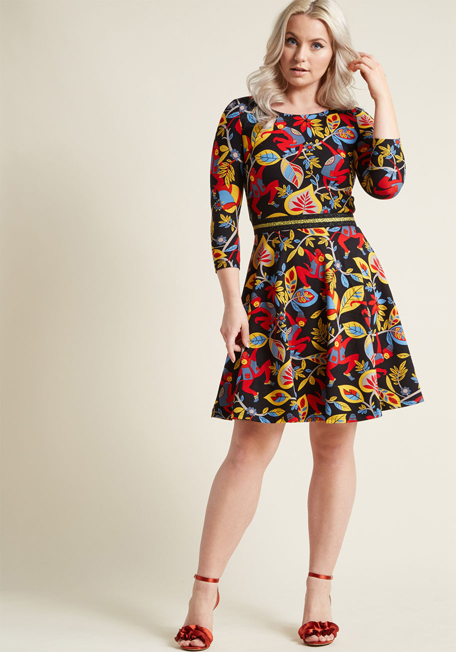 MB10866 - This colorful dress is so creative, it's like we pulled it straight from your imagination! Embodying the skater style you love through its ponte knit fabric, and infused with whimsy from its playful, primary-hued monkey print to its metallic gold waist, t