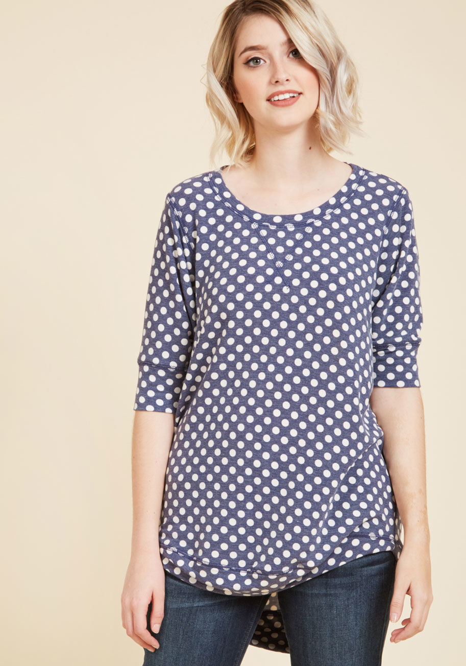 MC-1054 - This dotted top is always number one on your list of wardrobe faves! Complete with a high-low hem and a relaxed, dolman-sleeved silhouette, this steely blue shirt - a ModCloth exclusive - blends