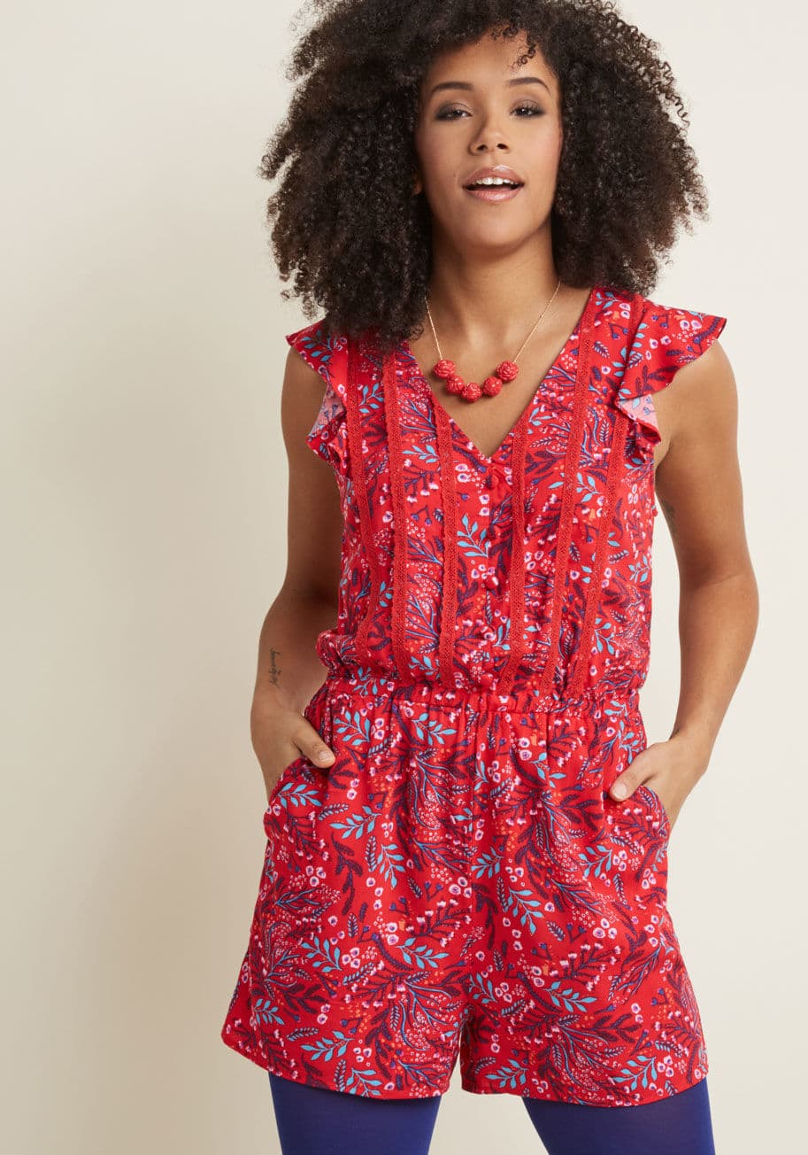 MCB1164B - The question is, where CAN'T you wear this red floral romper? Updated from a basic with feminine flutter sleeves, faux buttons and lace panels decorating its bodice, an elasticized waist, and pockets, this ModCloth namesake label playsuit makes deciding w