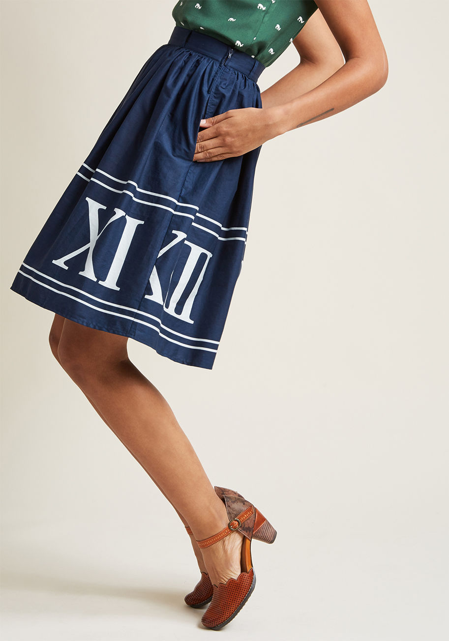 MCB1315 - Whoever believes staple pieces should only be solid needs to met the sweet versatility of this navy midi skirt! A cotton offering from our ModCloth namesake label, this A-line makes it a pleasure to pair its hidden pockets and white Roman numeral print wi