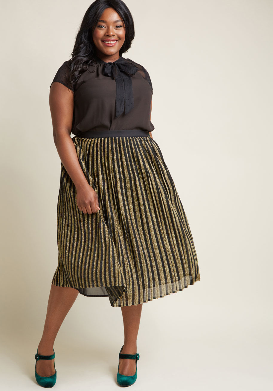 MCB1326 - Time to shine, lady! This knit skirt from our ModCoth namesake label welcomes a carnival of style into your look with black and metallic gold stripes and perfect pleats. Party ready? Hundred percent.