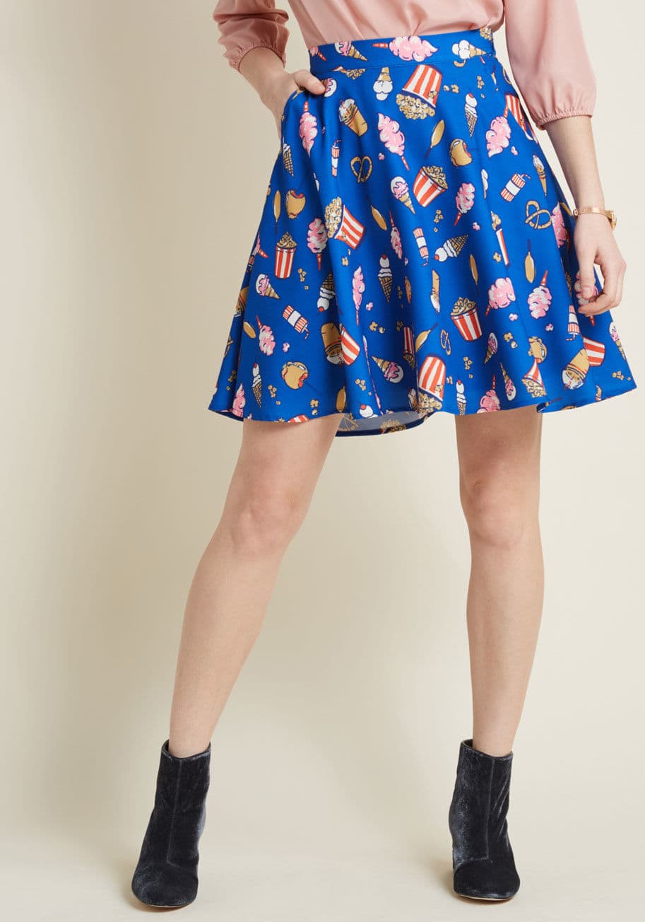 MCB1388 - As if the skater silhouette of this blue mini skirt wasn't playful enough, this piece goes one even further with a pattern of snacks galore! A delectable number from our ModCloth namesake label, this A-line touts pretzels, cotton candy, corn dogs, sodas, 