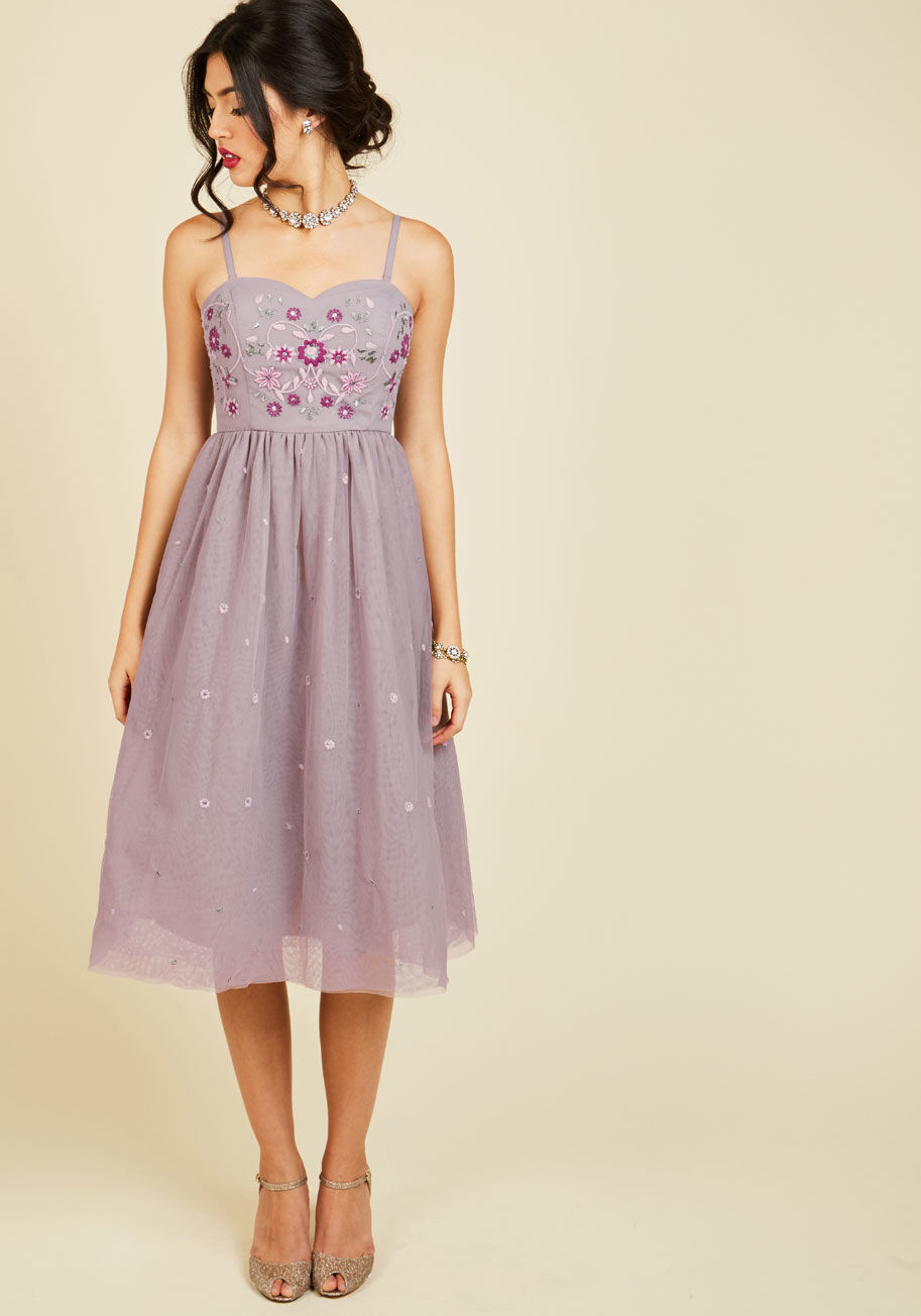 MCD1073 - Your efforts spent cultivating charm are apparent each time you flaunt this lilac midi dress! Part of our ModCloth namesake label, this tulle frock is fancied up with embroidered blooms, touches of metallic silver, and of course, a pair of side pockets. H