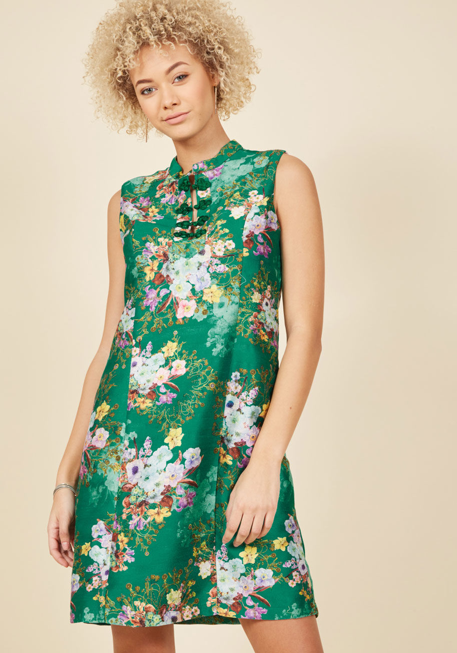 MCD1152 - In this emerald green shift dress from our ModCloth namesake label, you embody the brilliance of throwback style from its frog closures to down to its flattering princess seams! Finished with jewel-toned flowers atop grosgrain fabric, this vintage-inspire