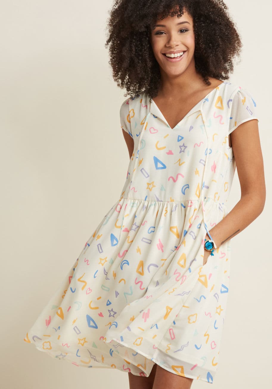 MCD1172A - We've taken playful frocks the next level with this ivory dress! Part of our ModCloth namesake label, this flowy piece touts sheer, slightly puffed sleeves, a notched neck with ribbon ties, and a colorful doodle pattern. This bright look sure adds charm t