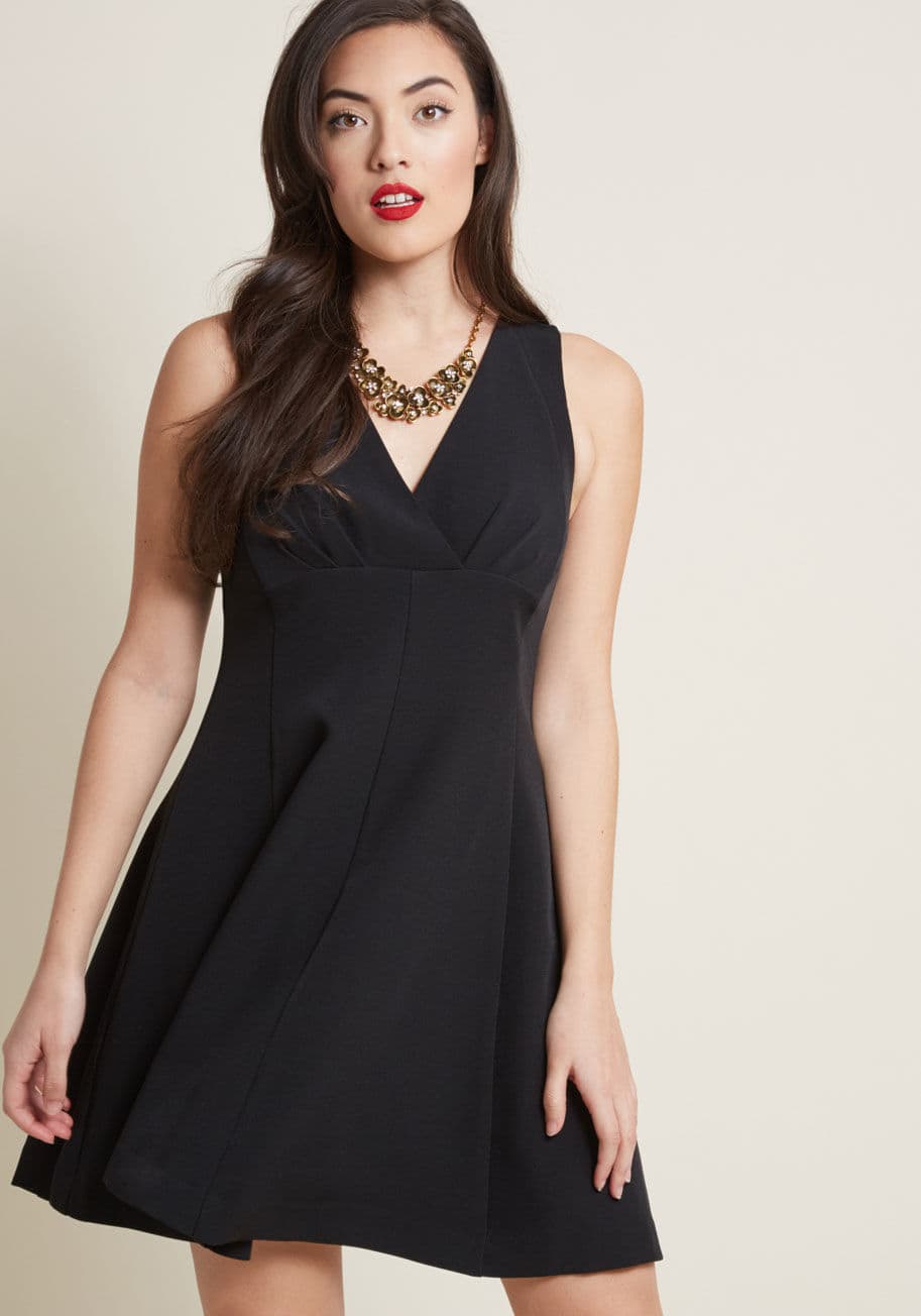 MCD1374 - Whether you debut this black dress at a work conference or cocktail hour, its pleated surplice neckline and swingy A-line silhouette will be confidence-boosting and charming alike. Part of our ModCloth namesake label, this empire-waist frock is fitting fo