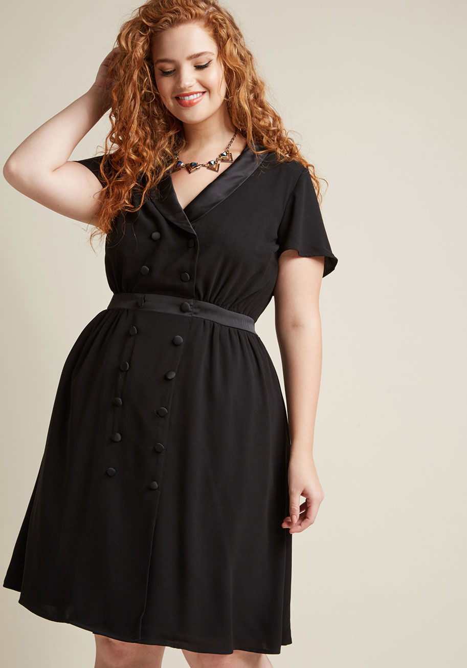 MCD1438 - This black dress from our ModCloth namesake label might be perfectly pulled-together, but it's nothing short of personality-filled, too! Its suave tux lapels are satiny to the touch, as are its decorative double-breasted buttons and elasticized-back waist