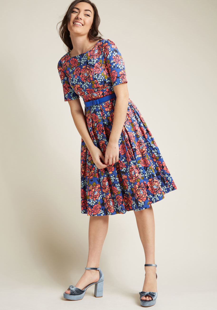 MCD1452 - You'll be a vintage-inspired vision every time you sport this floral dress from our ModCloth namesake label! A bateau neckline, half sleeves, a matching belt, pleats, pockets, a gorgeous blue hue - what doesn't this fabulous fit and flare offer up? Seems 