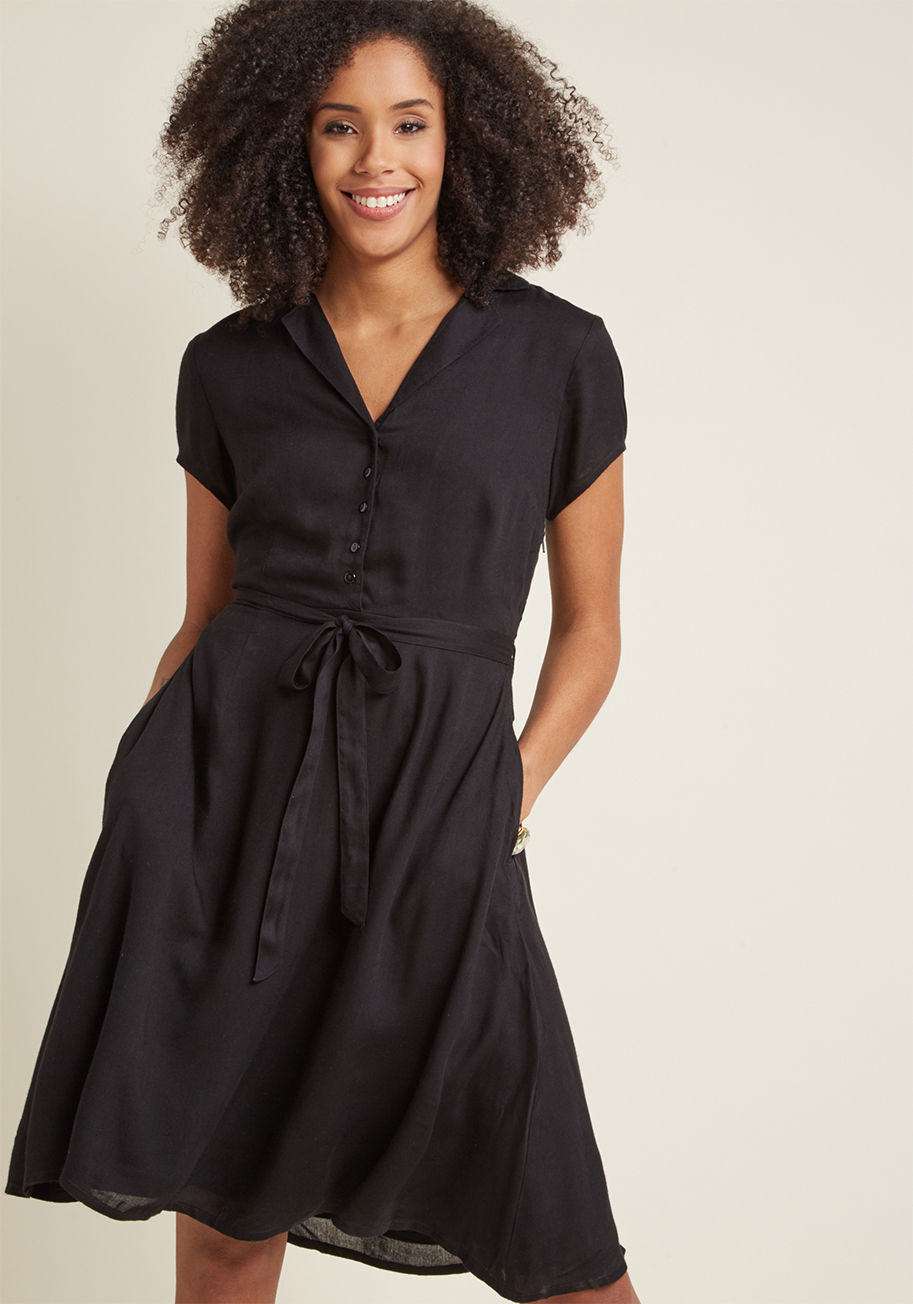 MCD1457 - Playful as your wardrobe may be, sophistication is always present. Such is the case with this black shirt dress from our ModCloth namesake label! Not only is it fabulously '50s-inspired from its lapel-boasting collar to its buttoned bodice, to its A-line 