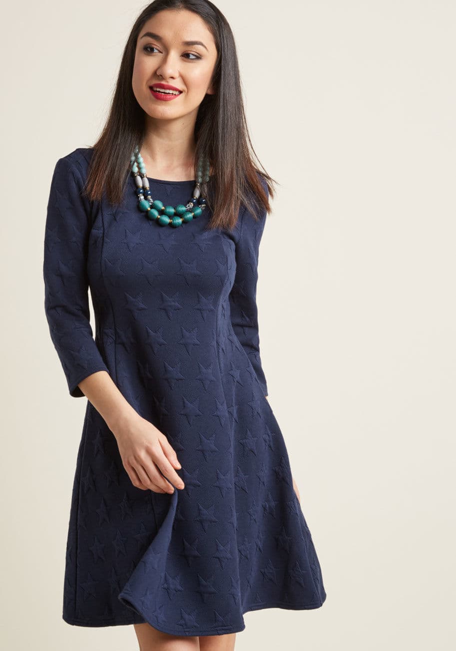 MCD1468 - What do you know about print mixing? Judging from your stretch-knit skater dress, you know an awful lot! Part of our ModCloth namesake label, this 3/4-sleeved number uses its navy hue to present a textured duo of micro stripes and bold stars on its scoop-