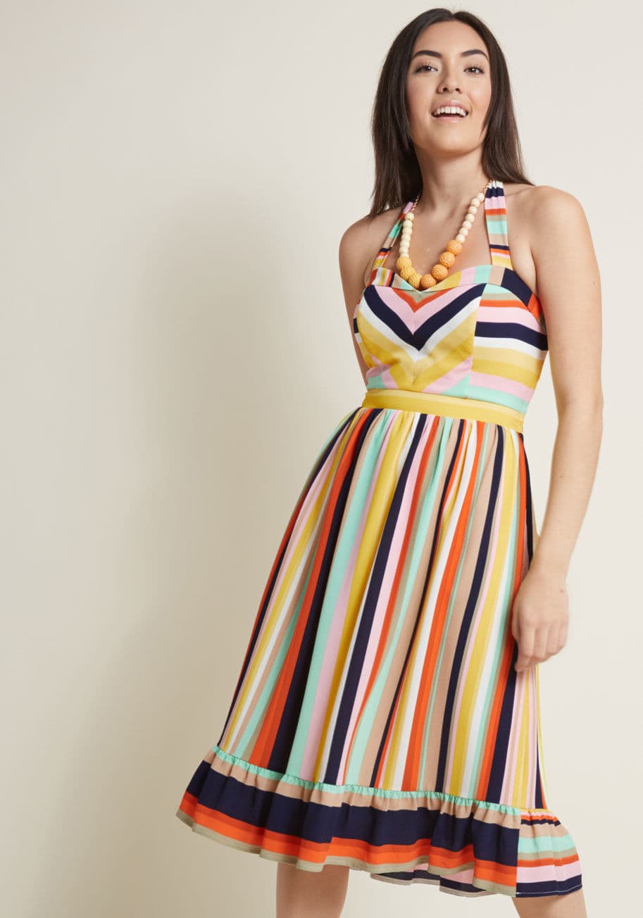 MCD1471 - With your bubbly brio and this colorful midi dress, your cheer travels far! Part of our ModCloth namesake label, this brilliant frock flaunts halter straps, brilliant stripes, and a ruffly hem, all of which pair with pockets to offer a uniquely crafted lo